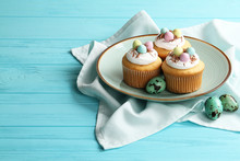 Easter Cupcakes On A Plate On A Table With Space For Text