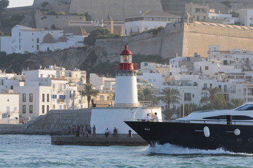 Wall Mural - Lighthouse at the port entrance of Ibiza town harbour