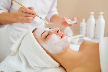 Wall Mural - woman in mask on face in spa beauty salon.