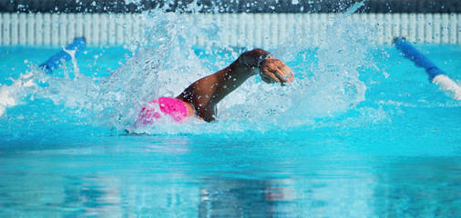 Male swimmer in an outdoor swimming pool,swimmer in blue pool water