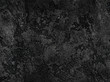 Natural black volcanic seamless stone texture venetian plaster background. Dark volcanic rock venetian plaster stone texture grain pattern. Black seamless grunge charcoal background texture rock coal