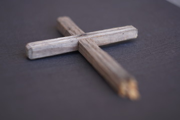 old wooden cross on a textured background