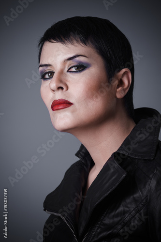 Brunette Woman Dressed In Leather Jacket Androgynous Appearance