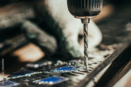 Fotografie, Obraz Drill screwdriver workflow creation of metal parts