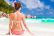 © el.rudakova - back view of long haired woman in bikini on tropical beach