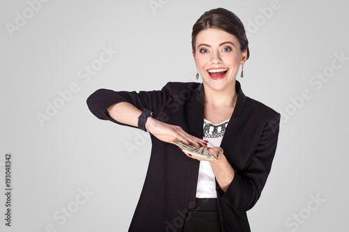 Fotografía Success woman showing at cash, dollar and toothy smile