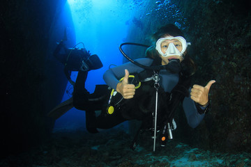 Sticker - Scuba dive. Young Asian woman scuba diving