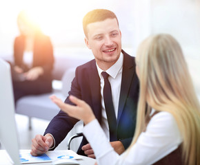 Manager talking with a colleague at the workplace