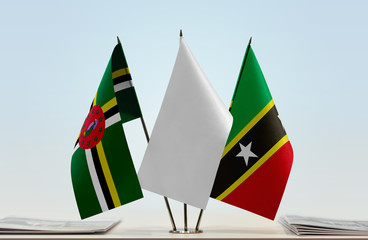 Flags of Dominica and Saint Kitts and Nevis with a white flag in the middle