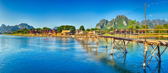 Wall Mural - Beautiful view of a bamboo bridge. Laos landscape. Panorama