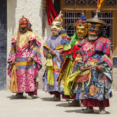 Wall Mural - Buddhist lamas dressed in mystical mask dancing Tsam mystery dance in time of Yuru Kabgyat Buddhist festival at Lamayuru Gompa, Ladakh, North India