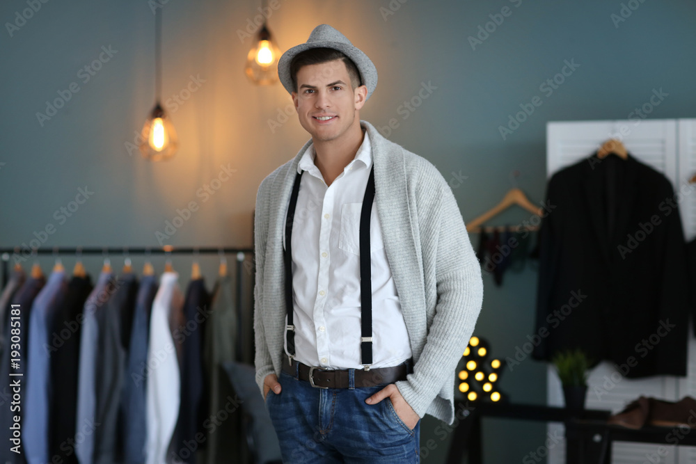 Man in new outfit indoors. Fashionable wardrobe