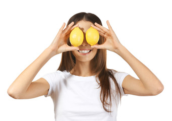 Wall Mural - Beautiful young woman with ripe lemons on white background