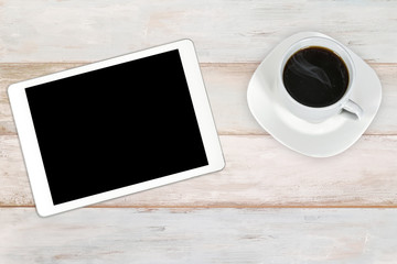 Wall Mural - concept of creative workplace - modern white and silver digital tablet with cup of coffee on a woode