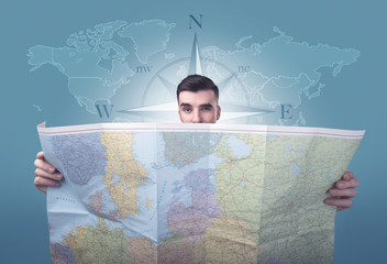 Young man holding map