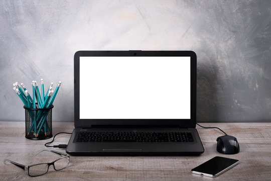 Workspaces mock up Laptop on wood table with glass phone smartphone pencil apple notebook mouse desk with copy space for graphics or products display montage.Working place of designer,close-up Office.