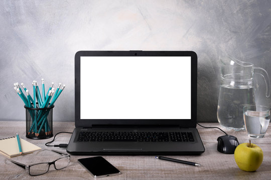 Workspaces mock up Laptop on wood table with glass phone smartphone pencil apple notebook mouse desk with copy space for graphics or products display montage.Working place of designer,close-up Office.