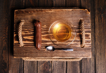 Wall Mural - cake with tea on wooden desk