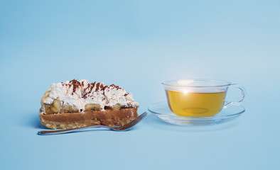 Wall Mural - cake with tea on blue background