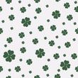 Green seamless pattern with four and tree leaf clovers for Saint Patrick's Day.