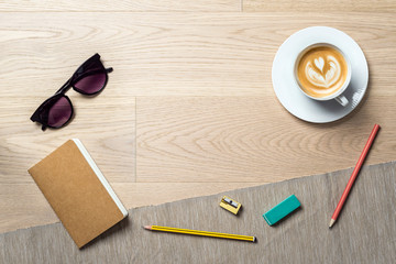 Wall Mural - Notebook and coffee as flat lay and template from above