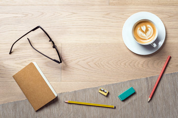 Wall Mural - Notebook and coffee as flat lay and template from above