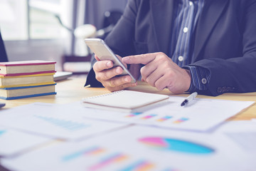 contact us concept,businessman working with modern devices, student boy using digital tablet computer and mobile smart phone,for business,selective focus,vintage color