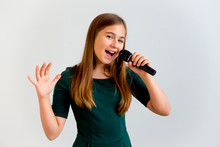 Girl Singing With A Microphone