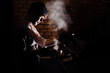 © Vulp - Close-up image of barista man using coffee-making machine to steam milk in cafe.