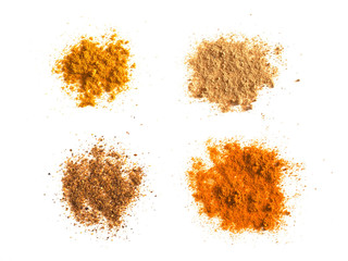 Wall Mural - many spices including Ginger Curry Turmeric and Chili Pepper over white