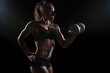 © Glebstock - Muscular fitness woman posing with the dumbbell