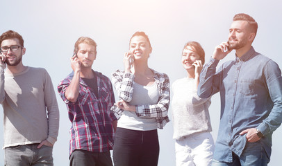 Canvas Print - group of students talking on their smartphones.