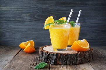 Canvas Print - Orange smoothie on a wooden table