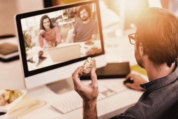 Poster - Composite image of graphic designers working at desk