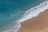 Fototapeta Niebo - Aerial Close Up View of an Empty Beach