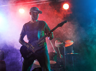 Wall Mural - The guitarist performs on stage.