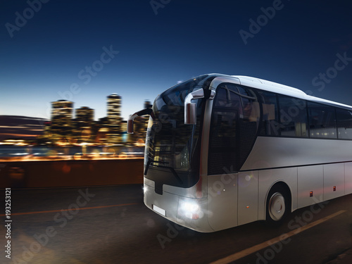Fotografie, Obraz Bus on the road at night with city landscape. 3D rendering