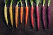 © Ramon Lopez Farinos/ADDICTIVE STOCK - Close up of carrots arranged against gray background
