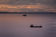 © Franco Nadalin - Seascape with ships and cloudy sky at sunset.