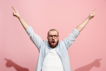 winning success man happy ecstatic celebrating being a winner. dynamic energetic image of male model