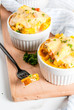Homemade italian bread casserole strata with cheese, egg and ham, white background copy space