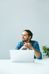 Man Working On Notebook In Office.