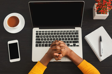 Aufkleber - Black female clenched hands on laptop, top view