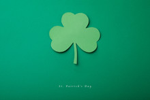 Paper Green Leaf Of Clover On Black Isolated Background. Happy St. Patrick's Day Good Concept Card.