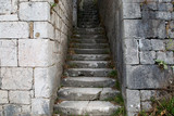 Fototapeta Na drzwi - narrow stone road to the fortress wall