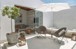 © Eduardo Huelin Photo/ADDICTIVE STOCK - Sunny patio with umbrella