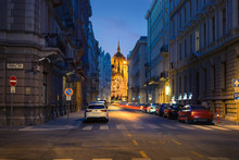 Parliament building in perspective of Akadémia street in Budapest, night view