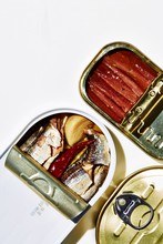 Overhead View Of Open Tin Of Sardines And Mackerel