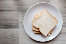 Toasted 3 Slice Of Bread On White Plate