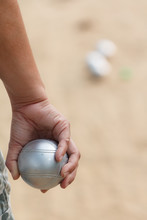 Hand Of Female Boule Holding Boule Or Petanque Ball On Match